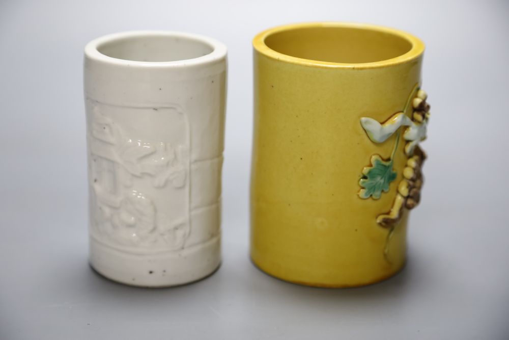 A blanc de chine brush pot together with a Chinese yellow ground brush pot, Qianlong mark but later, height 11cm